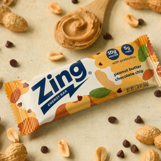 Zing energy bar with peanuts and chocolate chips on a beige background