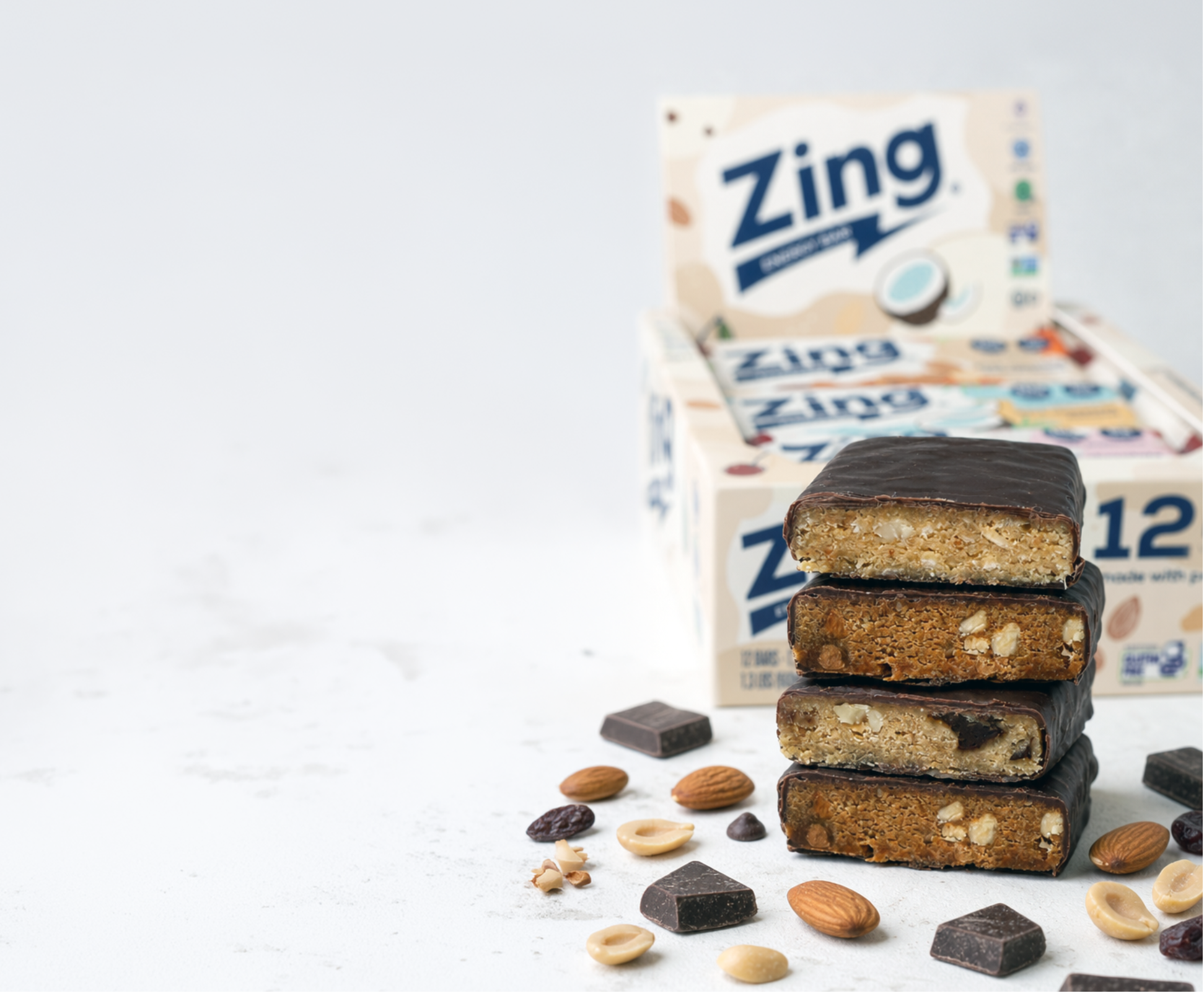 Zing energy bars with packaging on a light background